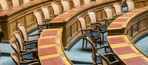 brown wooden chairs on blue and brown wooden floor