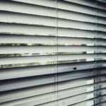 close view of white window blinds