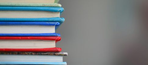 shallow focus photography of books